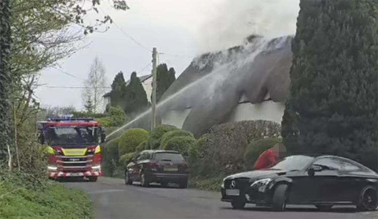 Wiltshire road closed as firefighters battle thatched cottage blaze