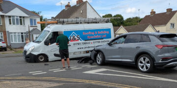 Van and car involved in crash outside Swindon supermarket