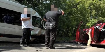 Man dead and children in hospital after minibus and car collide