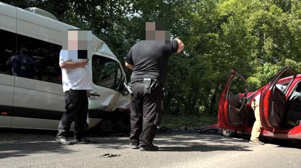Man dead and children in hospital after minibus and car collide
