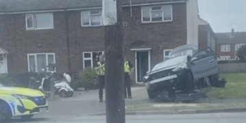 Car mounts garden fence during ‘dramatic’ crash in Swindon