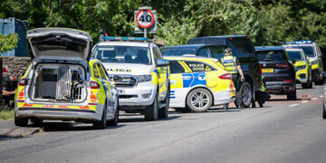 Armed police swarm house near Trowbridge with major road shut