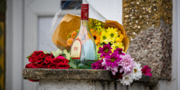 Floral tributes left after young man dies at house in Swindon
