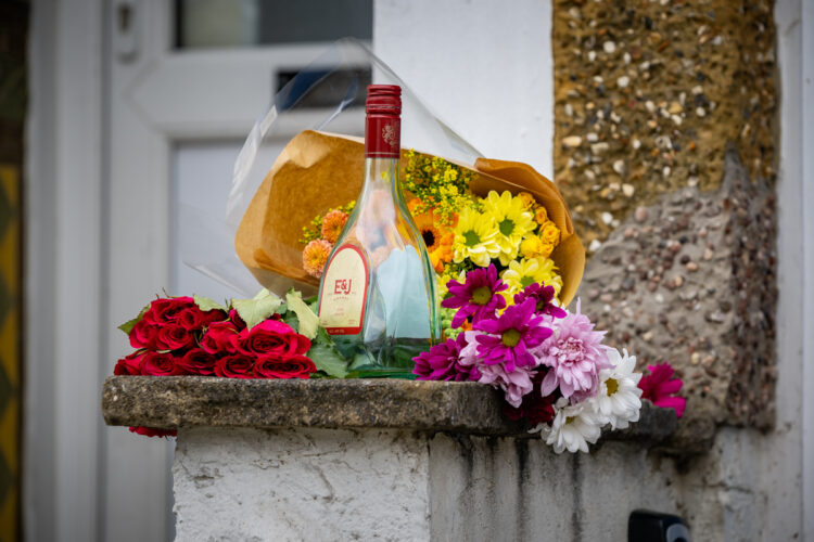 Floral tributes left after young man dies at house in Swindon