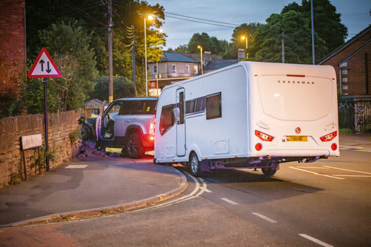 Car towing caravan crashes into garden wall in Chippenham