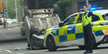 Car overturns in dramatic crash as Swindon road partially blocked