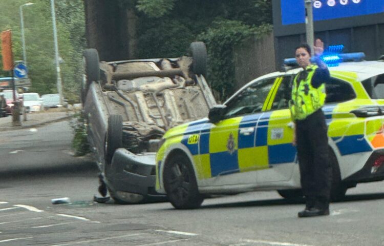 Car overturns in dramatic crash as Swindon road partially blocked