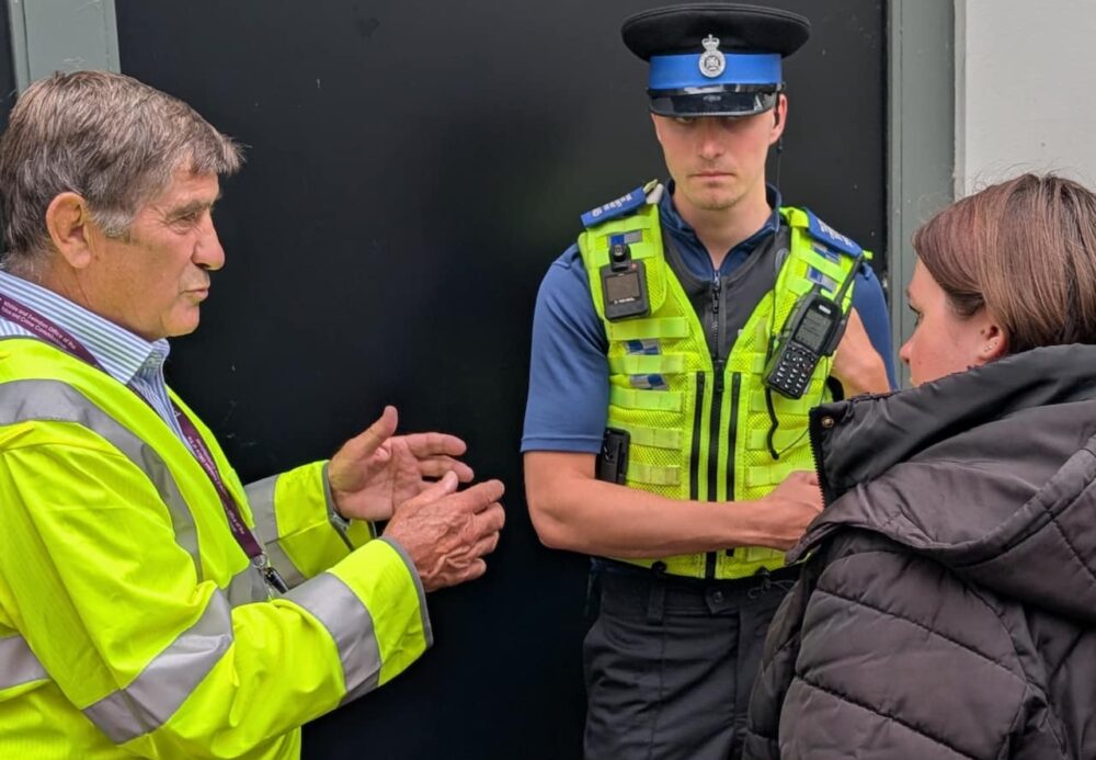 Police and Crime Commissioner, Philip Wilkinson and PCSO Harry Brain speaking to a shopper in Trowbridge