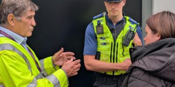 Police and Crime Commissioner, Philip Wilkinson and PCSO Harry Brain speaking to a shopper in Trowbridge