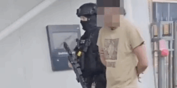 Armed police storm train following report of man carrying gun