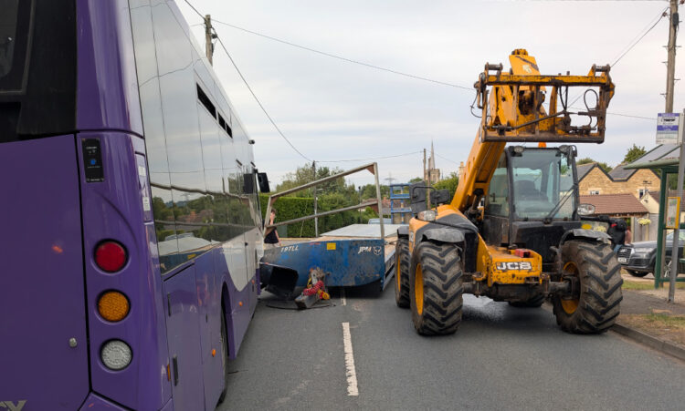 Two people injured after trailer smashes into bus near Melksham