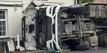 Emergency services respond as lorry overturns in Wiltshire village