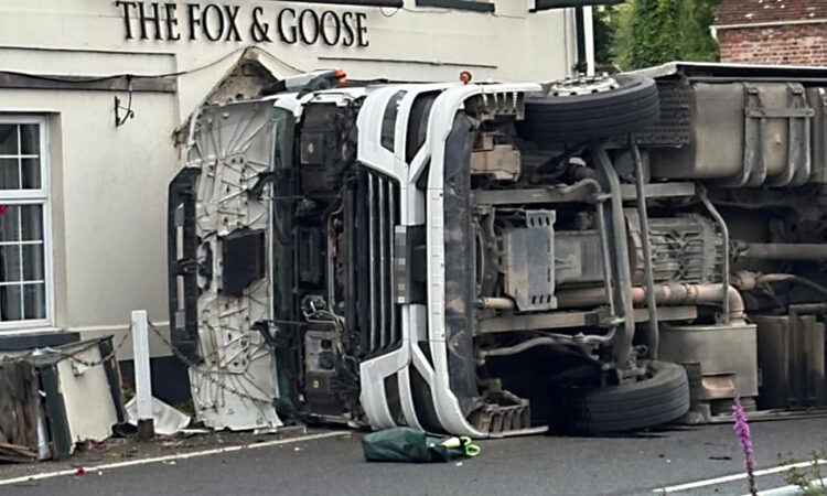 Emergency services respond as lorry overturns in Wiltshire village