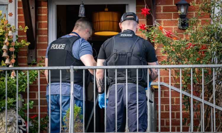 Police raiding a house in Larkham Rise, Chippenham