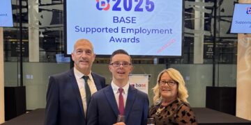 Luke Newton (centre) was awarded second place for the David Grainger Award at the British Association for Supported Employment ceremony at Wembley Stadium