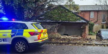 Woman hits garage after ‘losing control’ of car during ‘grim’ weather