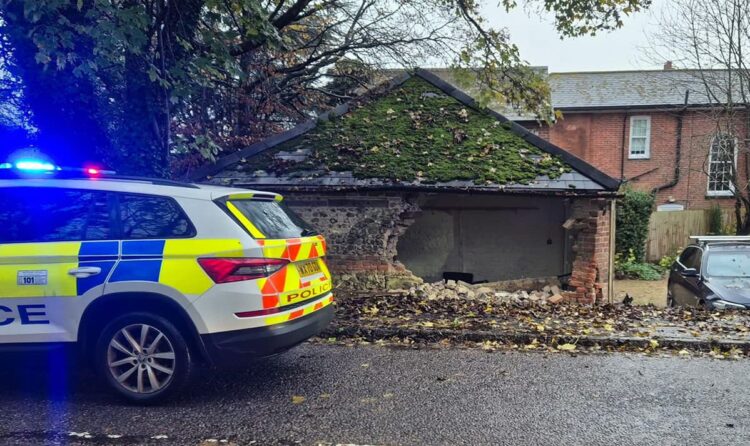 Woman hits garage after ‘losing control’ of car during ‘grim’ weather