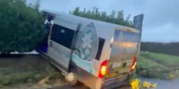 School bus crashes through hedge on busy route near Salisbury