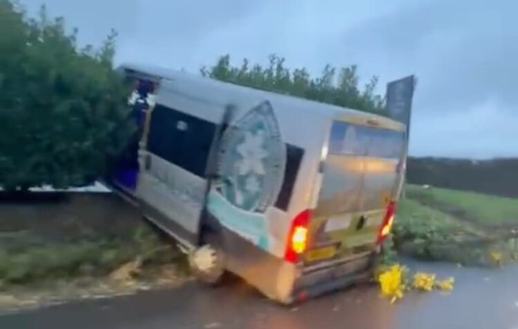 School bus crashes through hedge on busy route near Salisbury