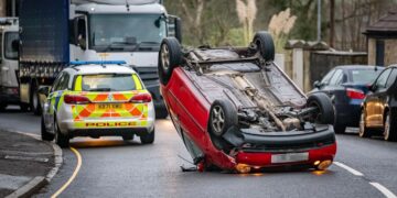 Woman ‘shaken up’ after flipping car onto roof in dramatic crash