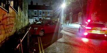 Police respond after car crashes into railings on steep hill in Swindon