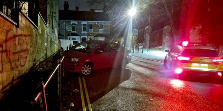 Police respond after car crashes into railings on steep hill in Swindon