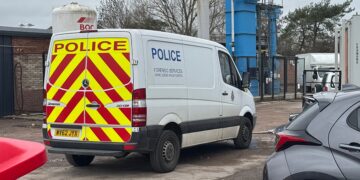 Police and forensics comb crime scene on industrial estate in Calne