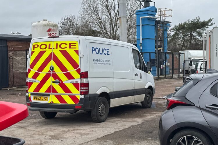 Police and forensics comb crime scene on industrial estate in Calne