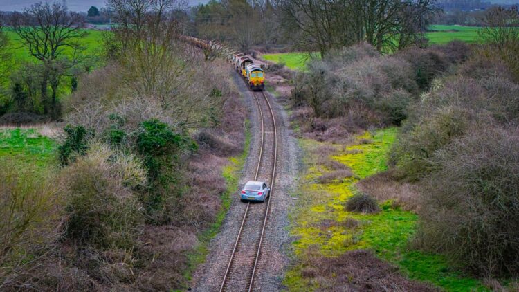 Three arrested after car driven onto railway tracks in police chase