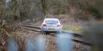 Three arrested after car driven onto railway tracks in police chase