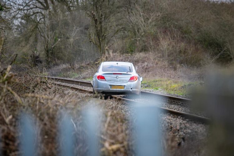 Three arrested after car driven onto railway tracks in police chase