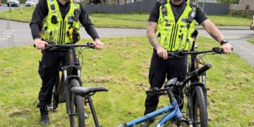 Police officers patrolling on bicycles seize illegal e-bike in Swindon