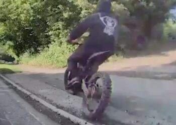 Police hunt illegal e-bike rider who nearly knocked down dog walker