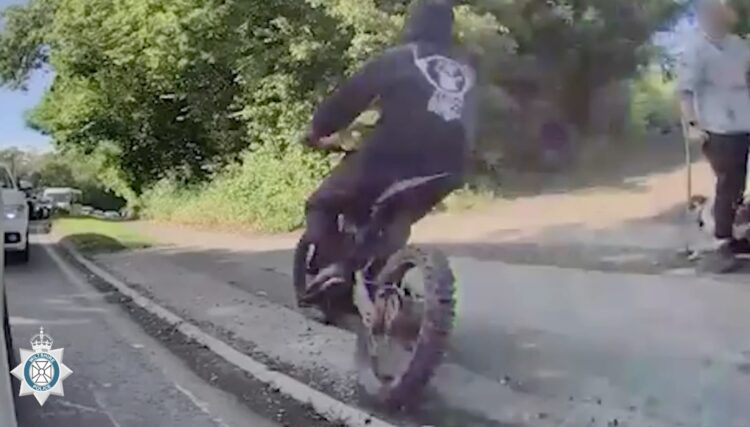Police hunt illegal e-bike rider who nearly knocked down dog walker