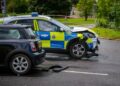 Woman in hospital after Mini hit by police car responding to 999 call