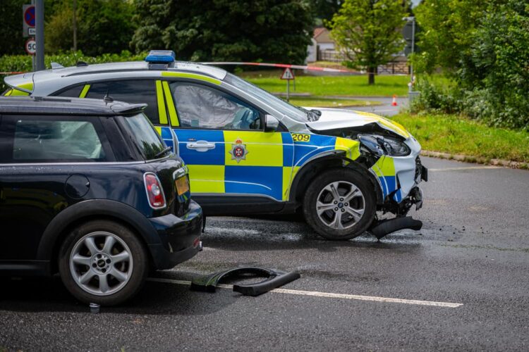 Woman in hospital after Mini hit by police car responding to 999 call