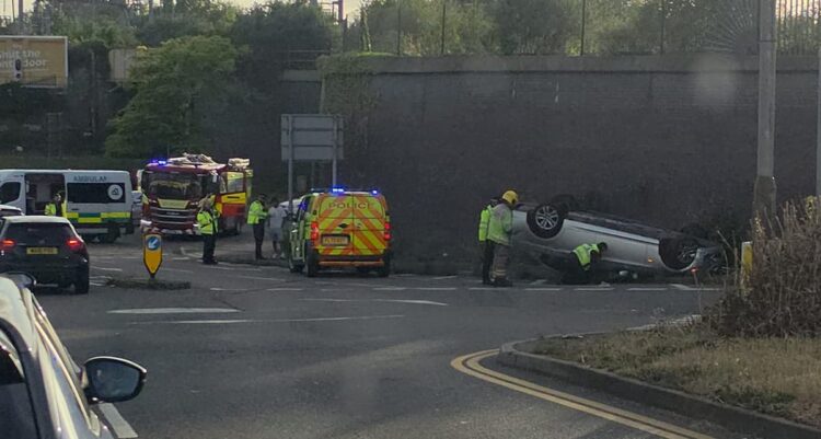 BMW flips onto roof in dramatic crash on busy Swindon junction