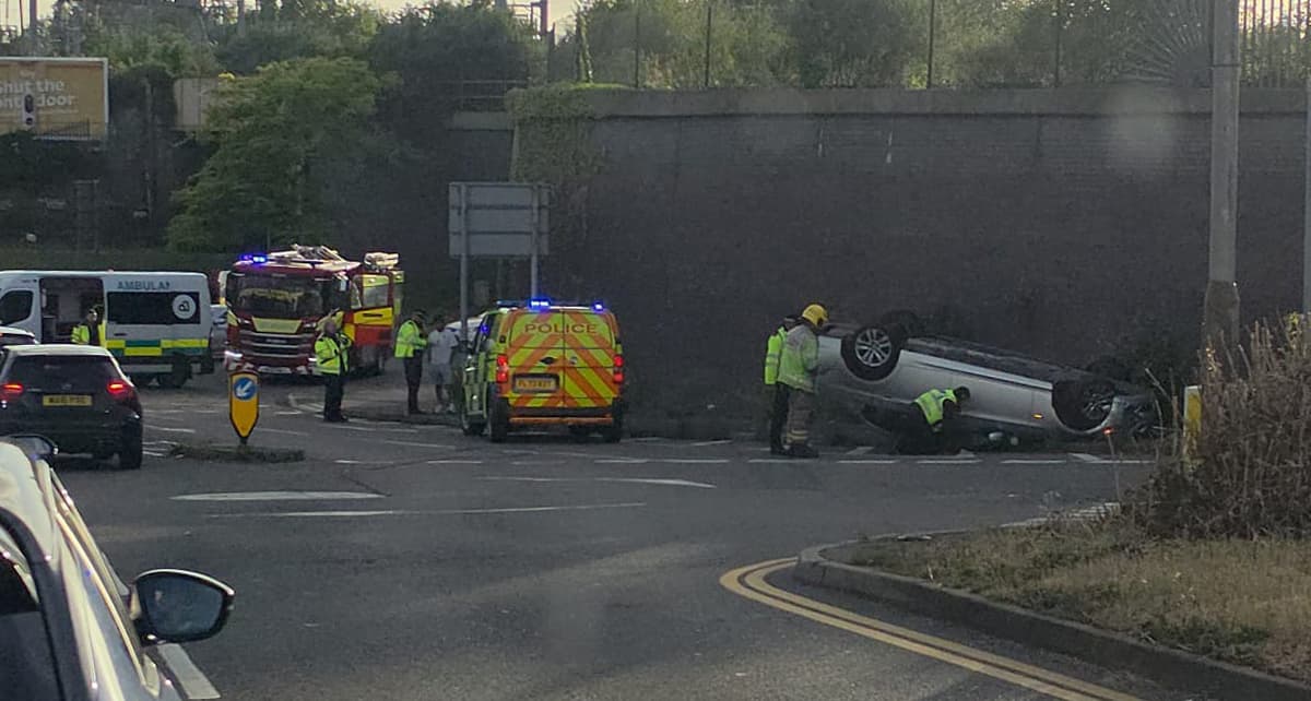 BMW flips onto roof in dramatic crash on busy Swindon junction