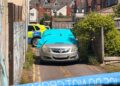 Forensics examine car in alleyway following hit-and-run in Swindon