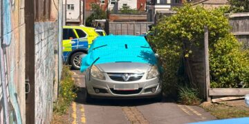 Forensics examine car in alleyway following hit-and-run in Swindon