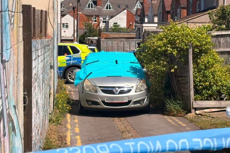 Forensics examine car in alleyway following hit-and-run in Swindon