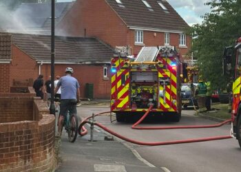 Firefighters tackle flames as blaze rips through garage in Swindon