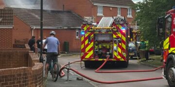 Firefighters tackle flames as blaze rips through garage in Swindon