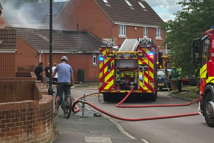 Firefighters tackle flames as blaze rips through garage in Swindon