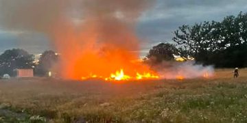 Firefighters tackle flames as bonfire spreads to grass near Trowbridge