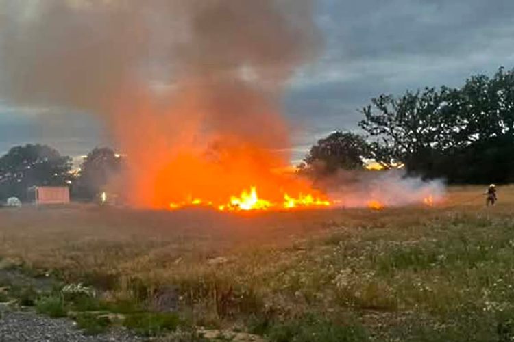Firefighters tackle flames as bonfire spreads to grass near Trowbridge