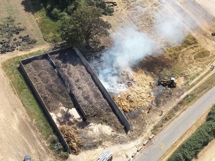 Fire destroys 600 hay bales as police hunt for three arson suspects