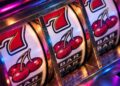 Classic fruit slot machine reels with cherries, red sevens and BAR symbols under colorful neon lighting