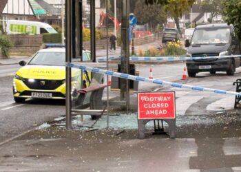 Police guard Swindon bus stop after glass strewn across pavement